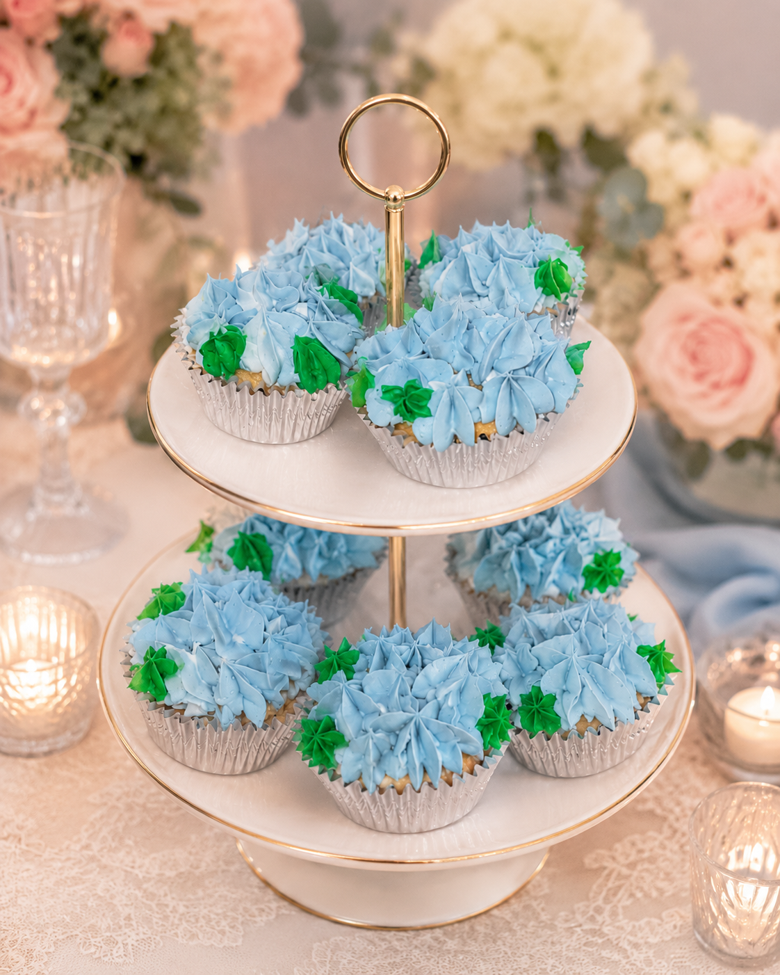 Hydrangea Garden — Lush hydrangea-inspired cupcakes piped in soft blues and greens — each bloom delicately crafted to bring a touch of garden elegance to any celebration